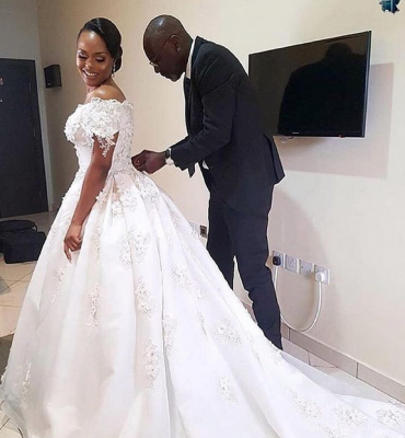Yemi Kosibah fitting the bride.