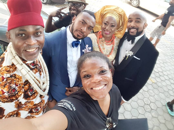 Kemi Adetiba takes a selfie with cast members of 'The Wedding Party'. Credit: Filed