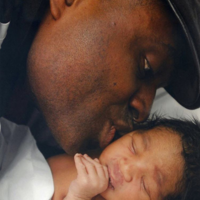 Kenneth Okonkwo dotes on new baby.