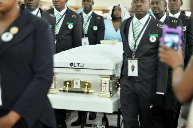 Pallbearers bringing in Keshi’s remains into the church in Benin