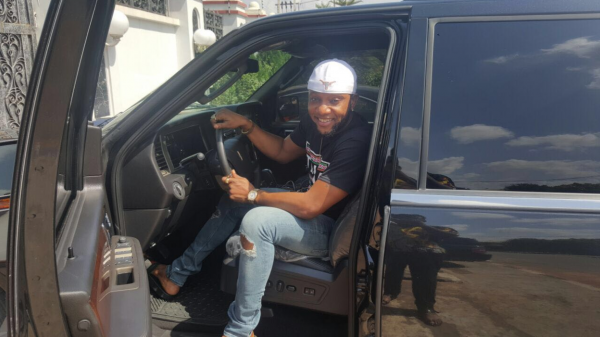 Kcee poses in his new whip.
