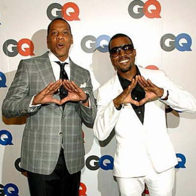 Jay Z and Kanye West making the Pyramid' sign.