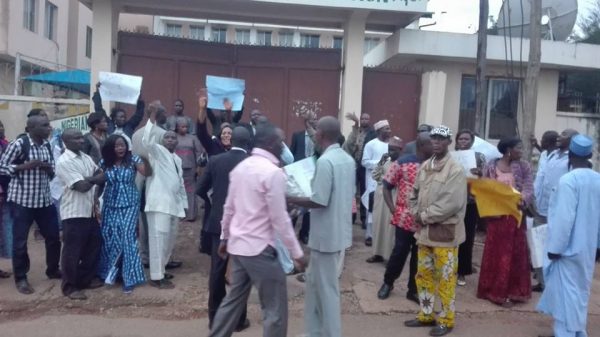 Staff outside the main gate of the Corporation's Headquarters 2