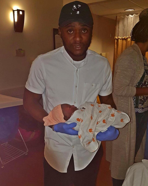 Ubi with his baby boy.