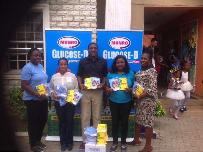 Head of Marketing, Brian Munro Limited, Abayomi Ajao with School Administrator, Headstart Private School,Mrs Udeaja, Head Teacher, Headstart Private School, Mrs Obialo during the Book presentation at Headstart Private School