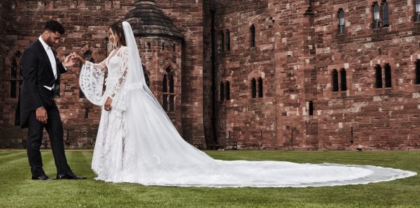 While Russell's suit was personally handcrafted by Giorgio Armani, Ciara donned a one-of-a kind Roberto Cavalli Couture wedding gown
