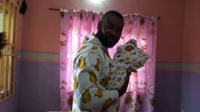 Prince Eke with his new baby