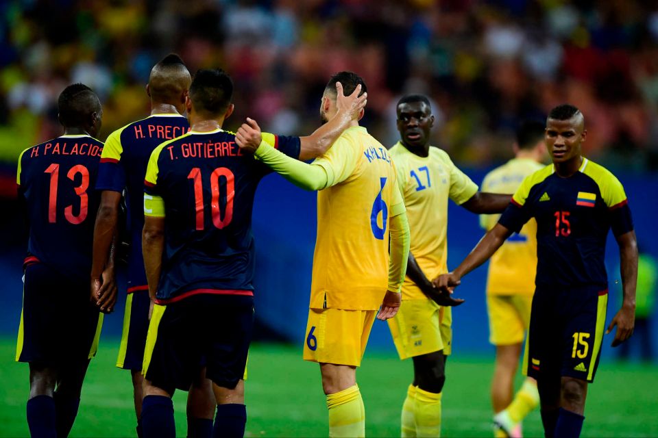 Colombia and Sweden players shake hands after a draw at Arena Amazonia. Credit: AP