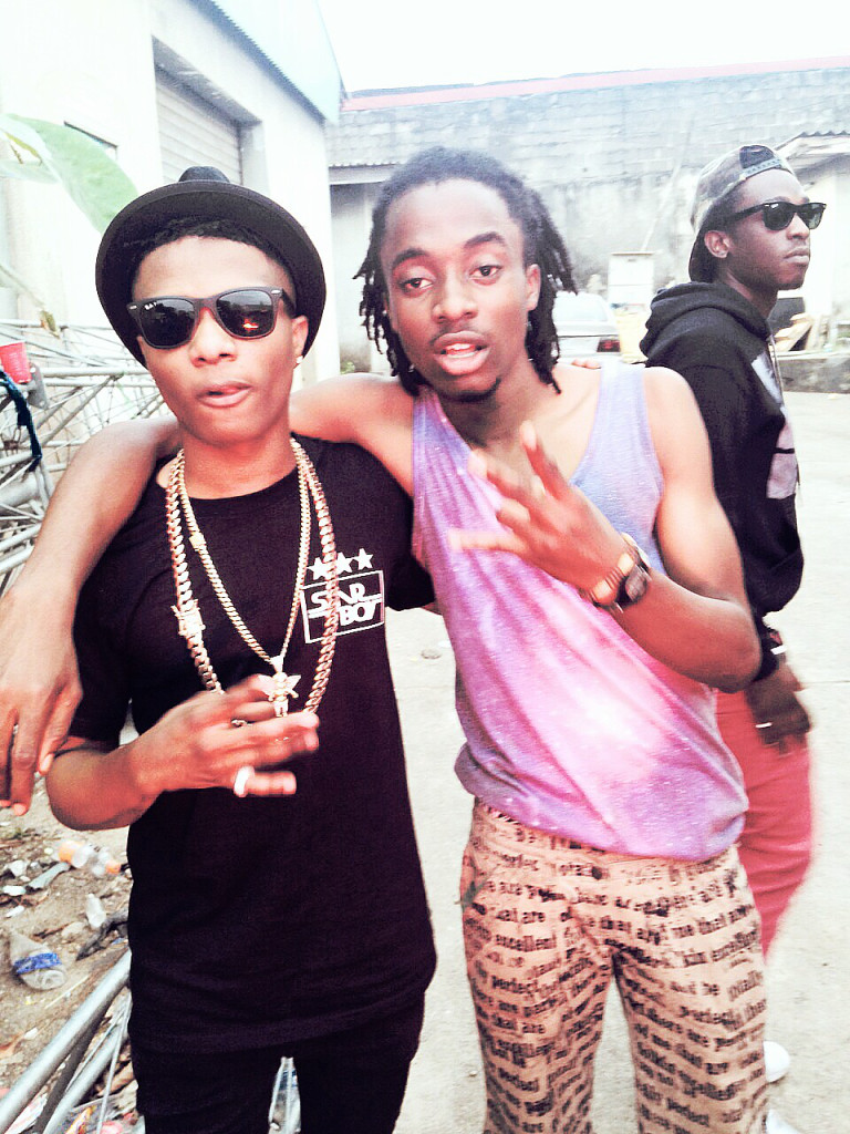 21-year-old Genesis strikes a pose with Wizkid. Credit: Glam