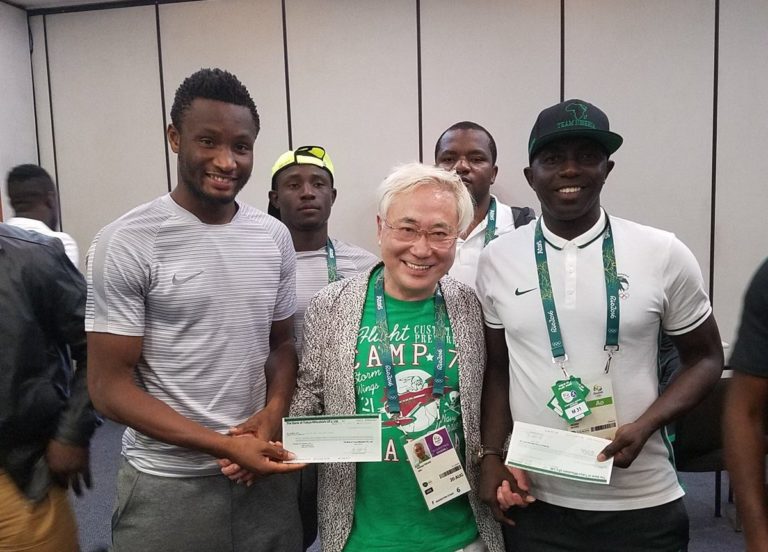Mikel Obi, Katsuya Takasu and coach Samson Siasia. Credit: AP
