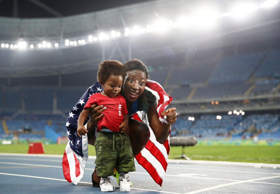 Nia Ali celebrates with her son Titus after winning silver in the women's 100-meter hurdles.