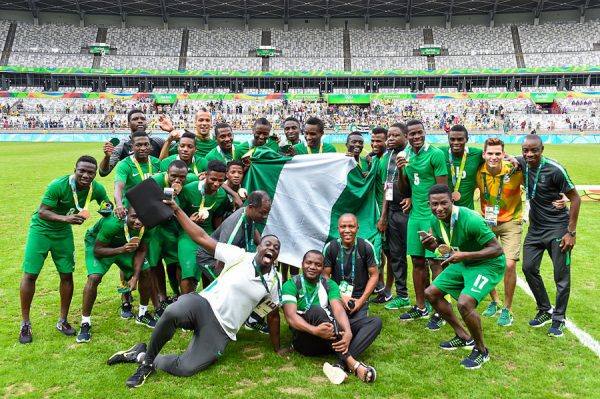 Nigerian players celebrate winning men's soccer bronze medal at the Olympics. Credit AP
