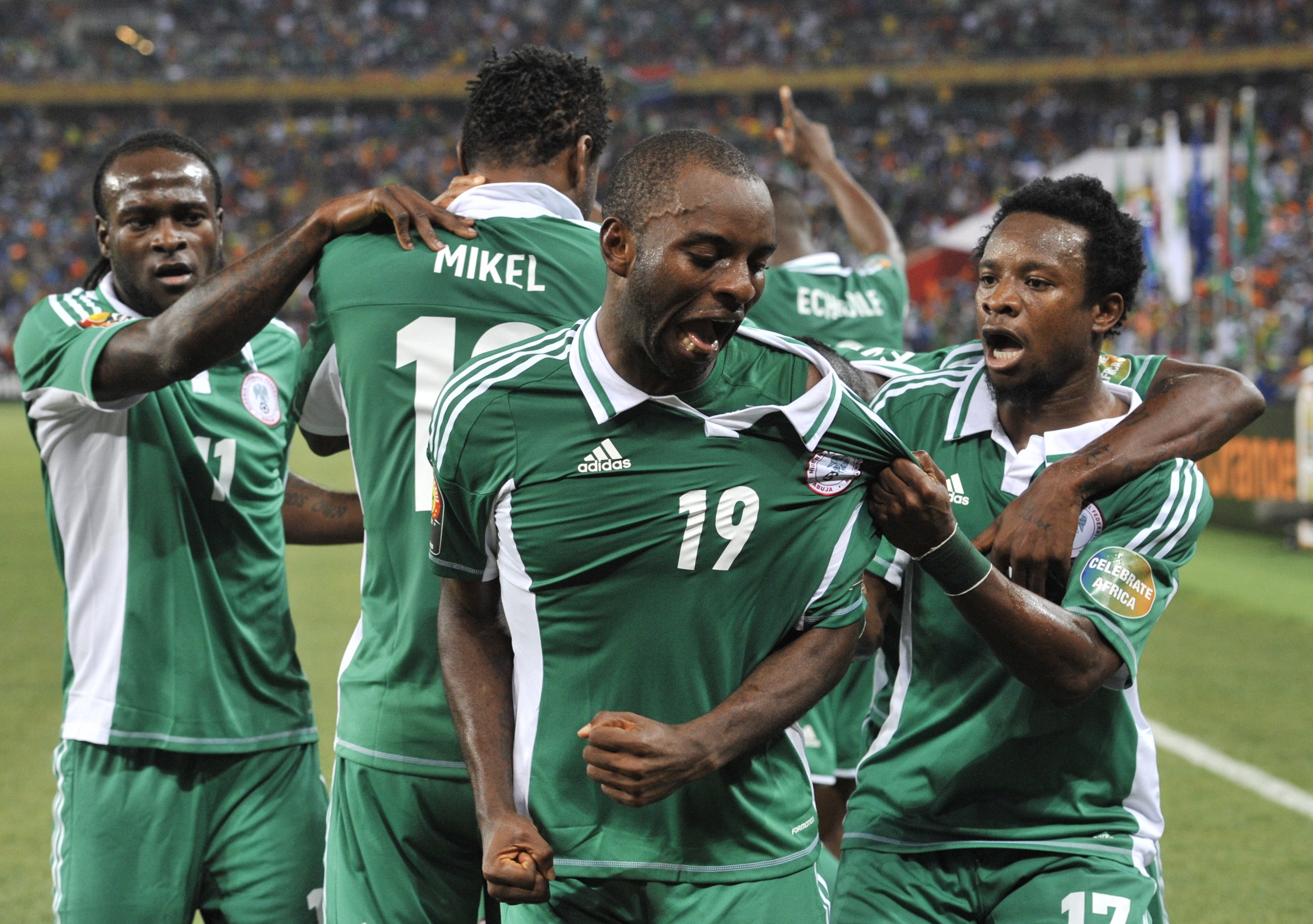 Nigeria's forward Sunday Mba (C) celebrates with teammates after scoring the opening goal against Burkina Faso during the 2013 African Cup of Nations final. Credit: AFP/ ISSOUF SANOGO