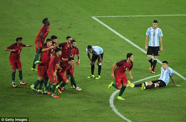 Paciencia and his teammates celebrate first goal against Argentina