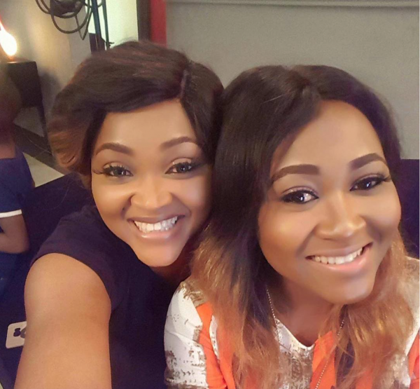 Mary twinning with Mercy Aigbe on the set of Single Ladies