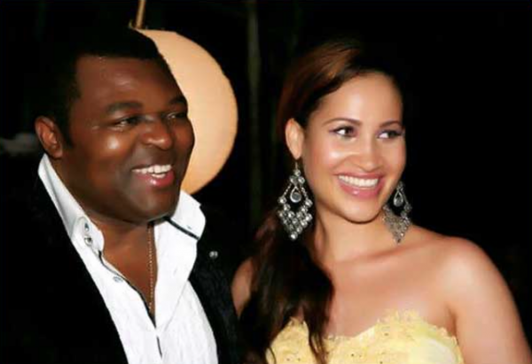 A smiling Caroline pictured with her husband