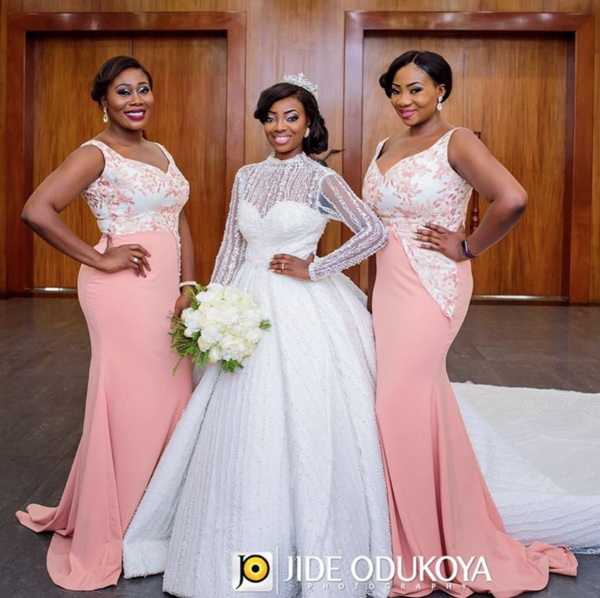 The bride poses with two of her bridesmaids