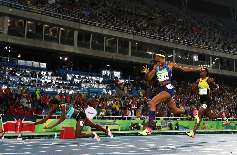 Shaunae Miller of the Bahamas dives to win gold over American Allyson Felix in the women's 400-meter