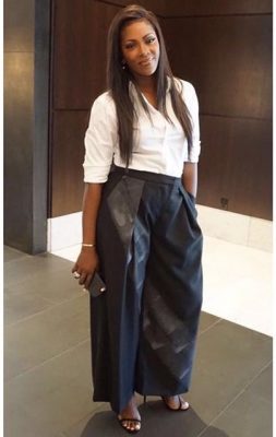 Tiwa Savage, dashing in black palazzo pants and a white shirt