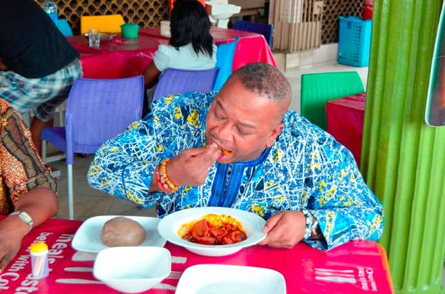 Media expert Olisa Adibua eating at a buka in Surulere. Photo: Various
