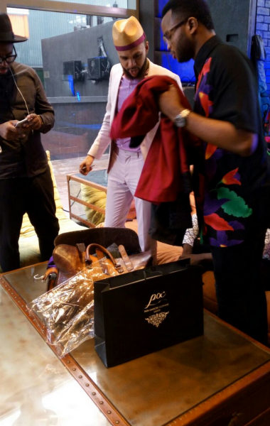 Jidenna checking out the outfit