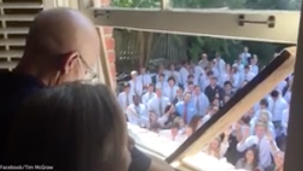 Students singing for teacher