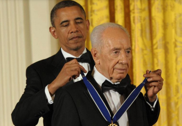 Barack Obama honors Shimon Peres with the Presidential Medal of Freedom at the White House in 2012. (photo credit:GPO)