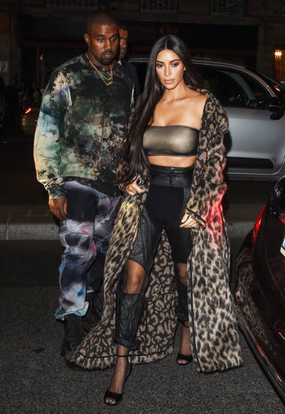Kim K and her equally bizarrely-dresssed husband on their way to the show
