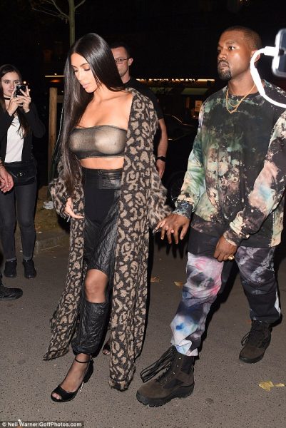 Kim and her husband walk hand-in-hand