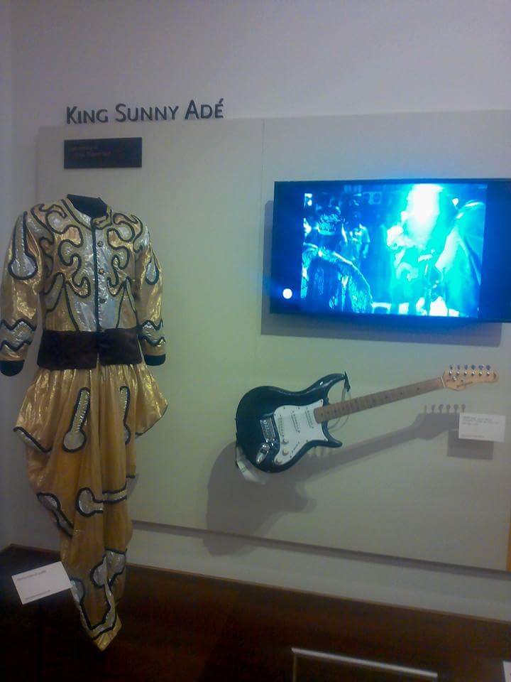 A guitar and stage costume owned by King Sunny Ade on display at the Musical Instrument Museum (MIM), a 200,000 square-foot facility which houses more than 15,000 musical instruments and associated objects from around the globe.