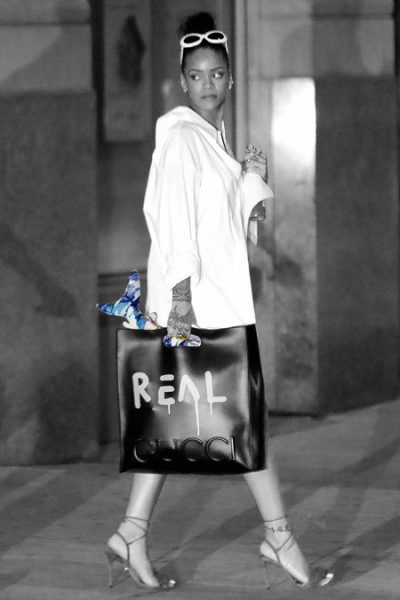 Riahnna carries the stuffed shark that was gifted to her by Drake