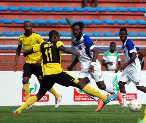 A player tackles an opponent