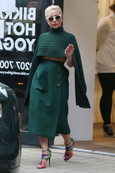 Lady Gaga rocks her green Salvatore Ferragamo striped cape like a boss
