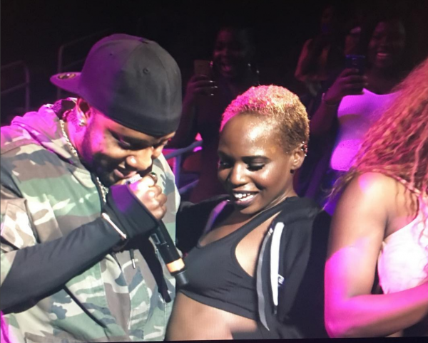 Kcee dancing with a fan