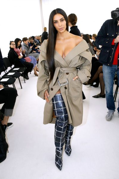 Kim was a natural beauty in this trench coat and thigh-high boots