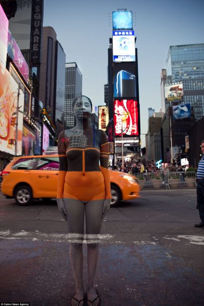 Model merges with yellow cab and lights of New York Times Square Photo: DailyMail