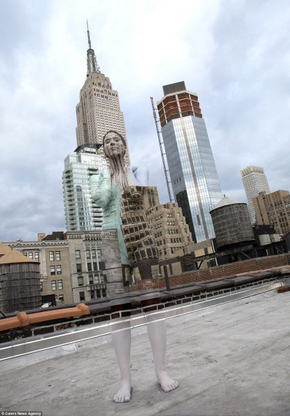 Model poses in front of the Empire State Building in New York