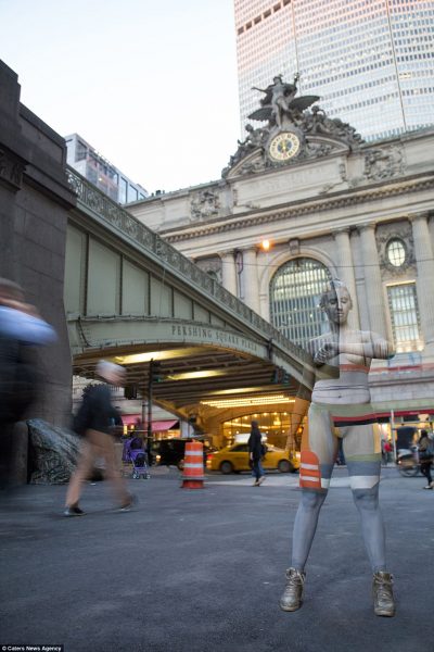 Model merges with the scenery at Grand Central Station