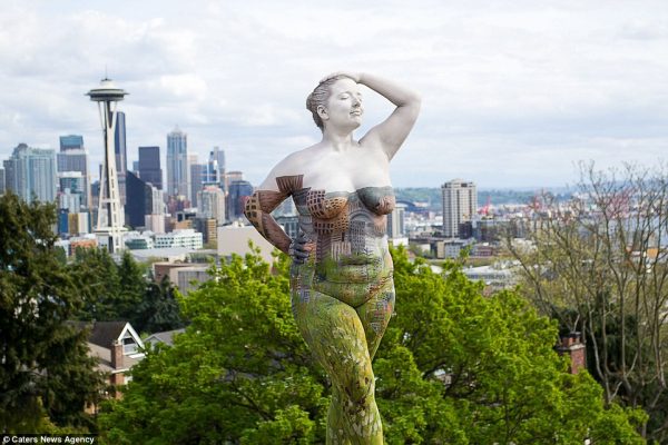 Camouflaged model in Seattle's famous skyline