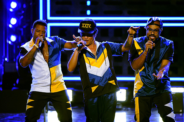 Singer Bruno Mars (C) performs onstage during the 2016 American Music Awards at Microsoft Theater on November 20, 2016 in Los Angeles, California. Credit: Kevin Winter/Getty Images
