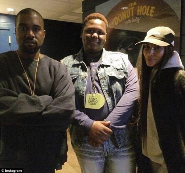 Kim poses happily beside her husband and 16-year-old Cameron Sterling