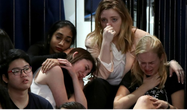 Hillary Clinton supporters react as results come in showing Trump gains across battleground states. But are they upset enough to emigrate?