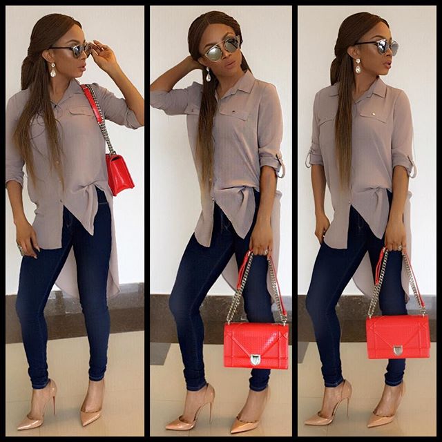 Toke looking good in casual paired with a 'dior' handbag