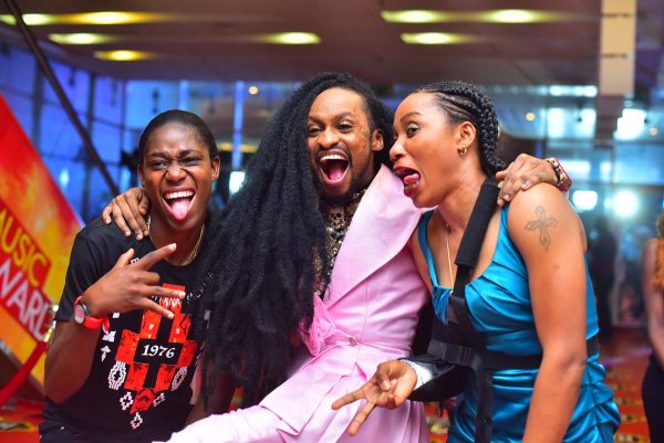 Asisat Oshoala (L) and Denrele (M)