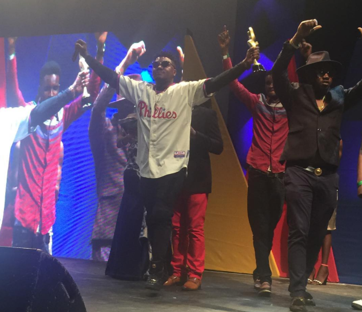 CDQ receives award on stage.