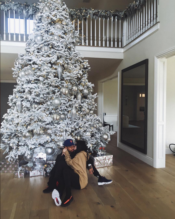 Then she took a picture with this huge Xmas tree with her boyfriend