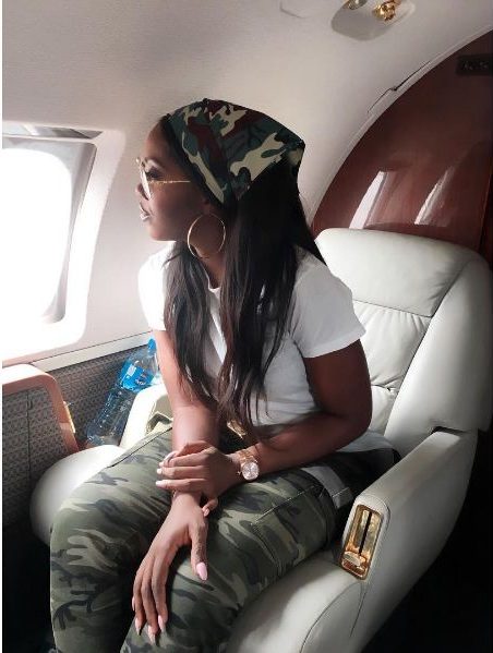 Tiwa in white T-shirt and camo