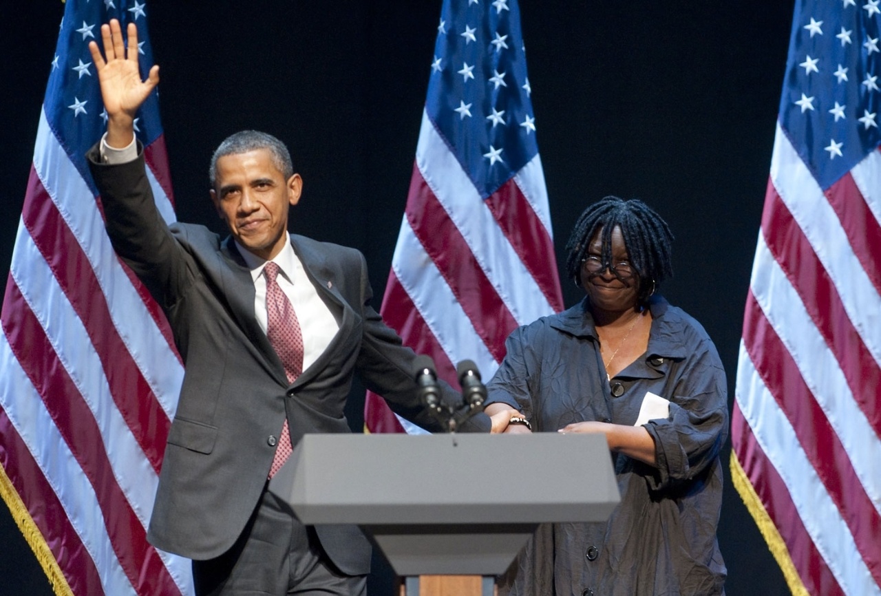 Obama held her hand as he waves to the crowd at a 2011 fundraising gathering.