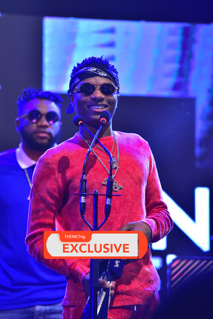 Wizkid receives his award for African Artiste of the Year at the 2016 MVP awards.