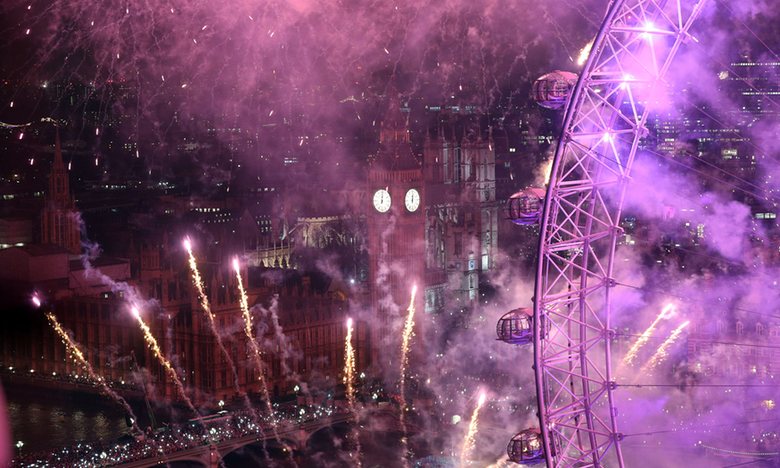 Fireworks light up the sky over the London Eye in central London during the New Year celebrations. Photograph: Jonathan Brady/PA